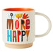Mug with colorful text 'MORE HAPPY' on a white background