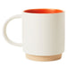 White mug with orange interior on a white background