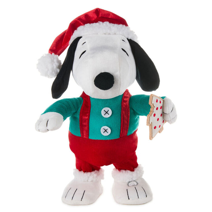 Plush toy of a dog wearing a Santa hat and outfit on a white background