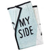 Folded towel with 'MY SIDE' text on a light blue and white patterned background