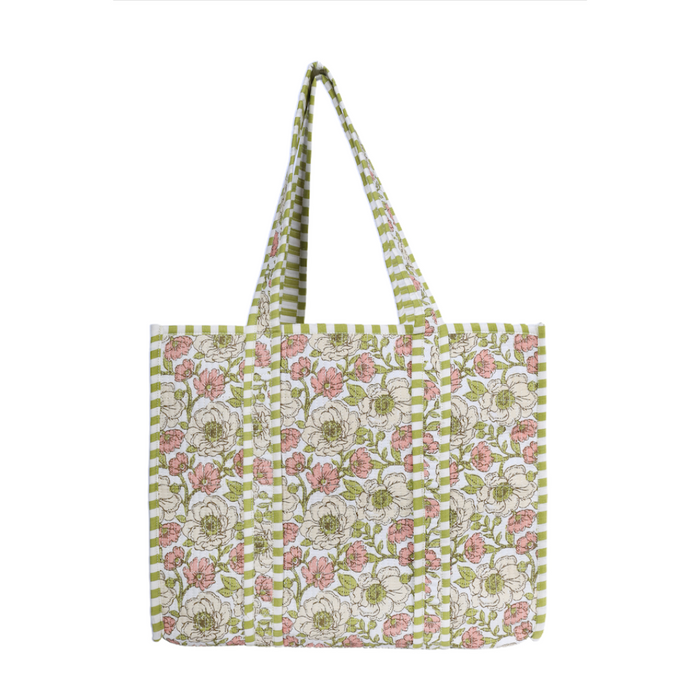 A tote bag with a green and white striped border and handles, featuring a central panel of white flowers with pink centers and green leaves on a white background.