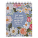 Notebook with floral design and text on a blue background