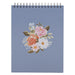 Notebook with floral design on a blue background