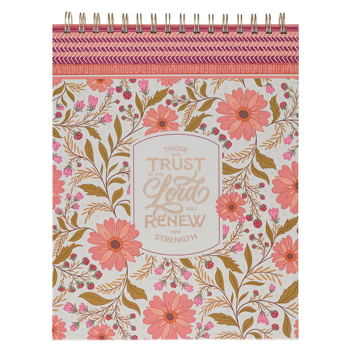 Notebook with floral design and motivational quote on a white background
