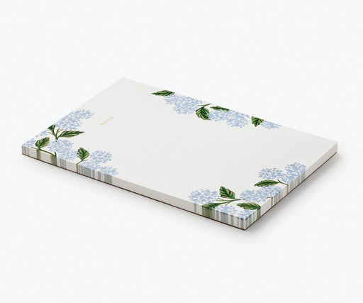 Notepad with floral design on a white background