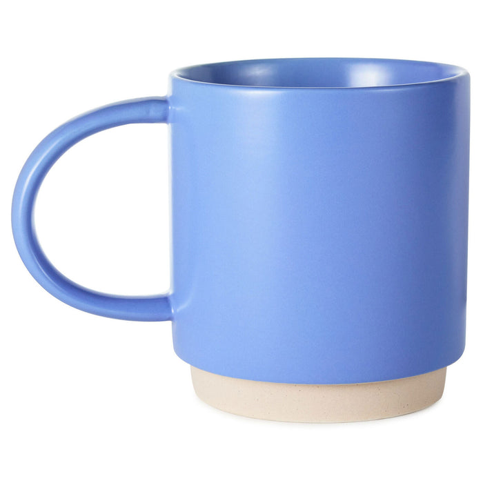 Blue mug with a beige base on a white background