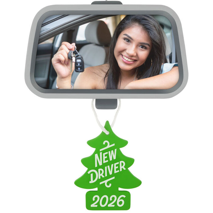 Car mirror with a woman holding keys, green 'New Driver 2026' tag below.