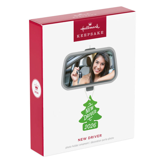 Hallmark Keepsake ornament packaging with a photo of a woman and a green tree ornament on a white background.