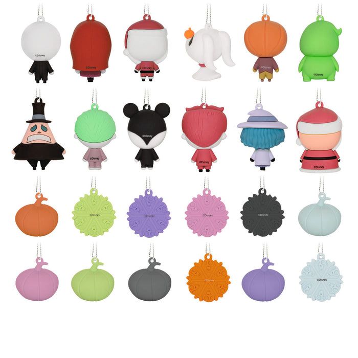 Set of colorful character-shaped keychains on a white background