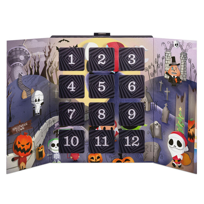 A Halloween-themed advent calendar with 12 numbered black doors arranged in a grid over a spooky illustrated backdrop featuring pumpkins, skeletons, a mummy, and haunted houses.