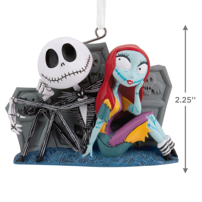 Decorative ornament of a skeleton couple sitting on a bench with dimensions indicated.
