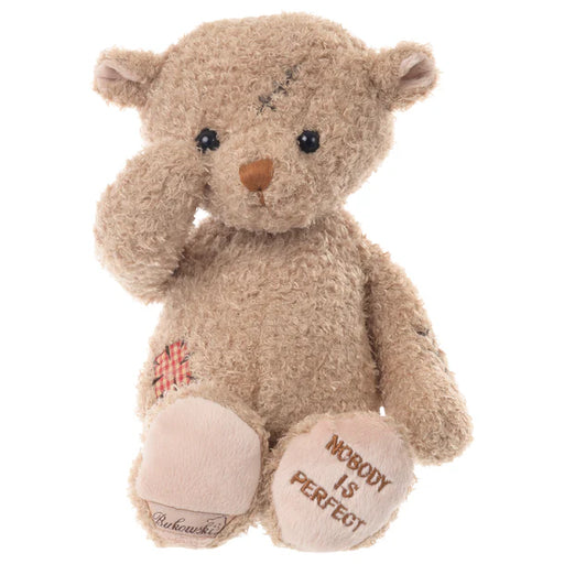 Teddy bear with embroidered message on a white background