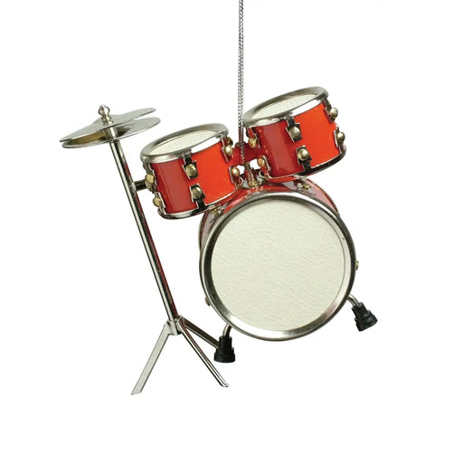 A miniature toy drum set hanging from a silver string, featuring red drums with gold hardware and a white bass drum, set against a plain white background.