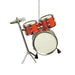 A miniature toy drum set hanging from a silver string, featuring red drums with gold hardware and a white bass drum, set against a plain white background.