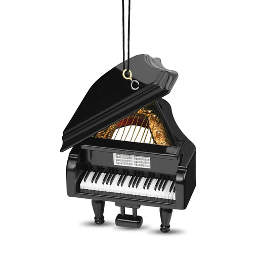 A miniature black grand piano ornament with its lid open, showing gold-colored strings and a black-and-white keyboard, hanging by a black cord with a gold ring and silver hook on a white background.