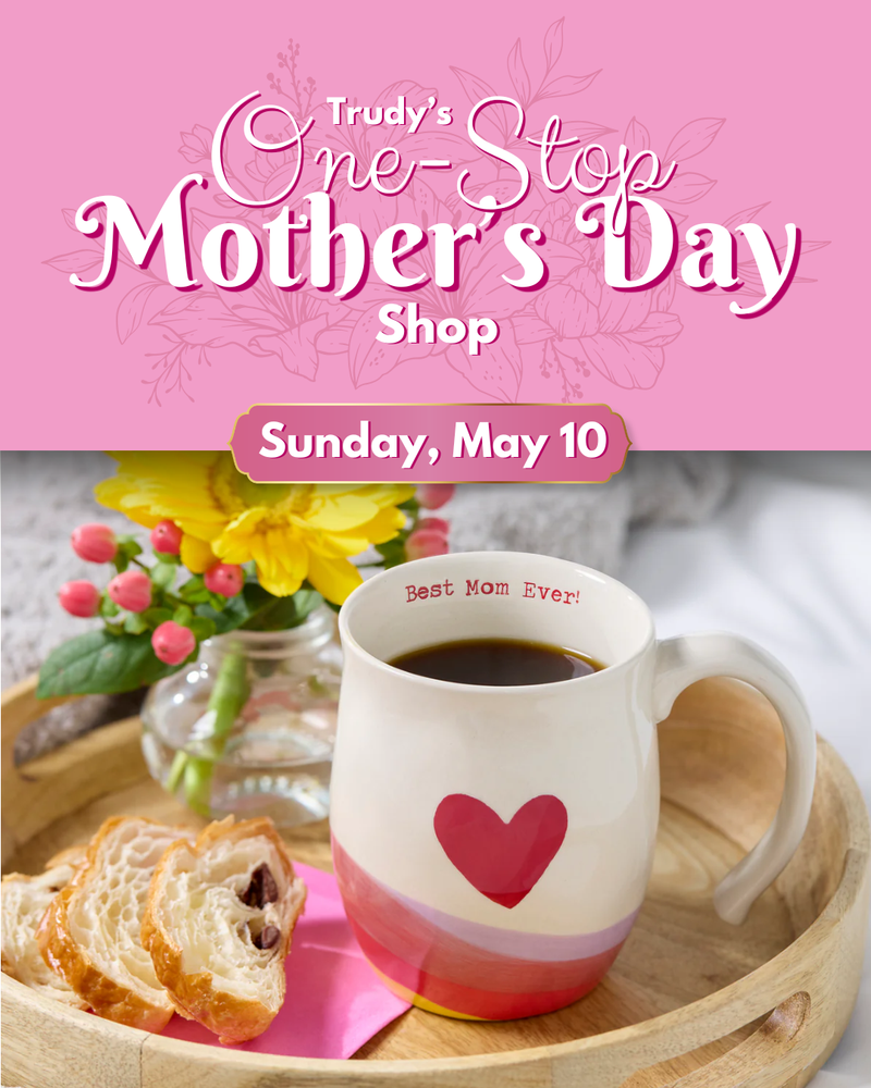 Promotional flyer for Trudy's One-Stop Mother's Day Shop with a mug, flowers, and bread on a pink background.
