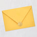 Yellow envelope with a gold seal on a light gray background