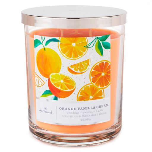Candle with an orange and vanilla flavor label on a white background