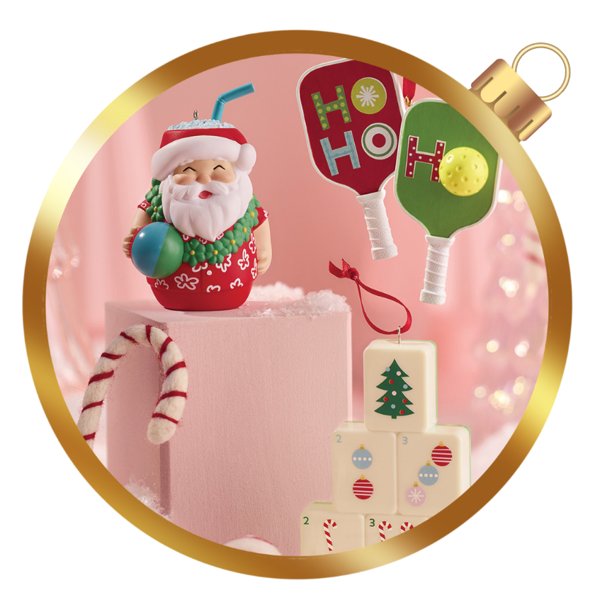 Hallmark Keepsake ornaments featuring a tropical Santa tumbler, pickleball paddles, and colorful holiday designs.
