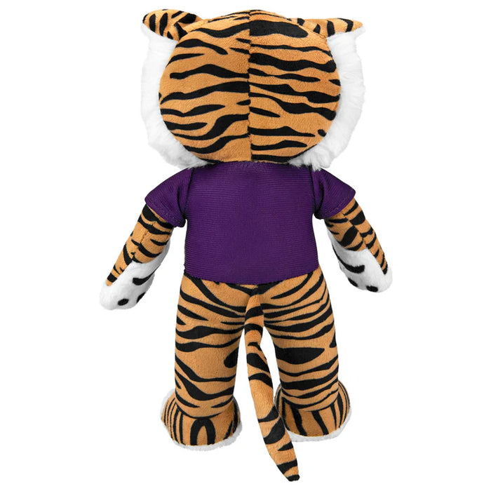 Plush toy tiger with a purple shirt on a white background