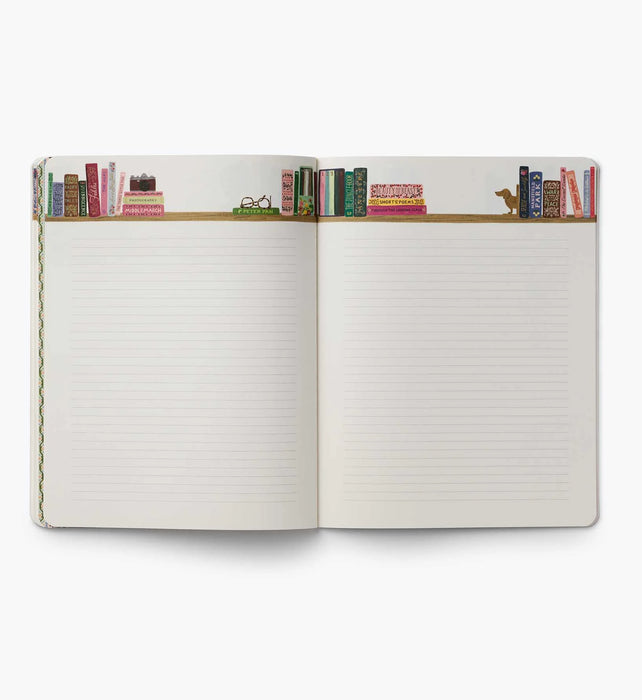 Open notebook with lined pages and decorative top edge on a white background