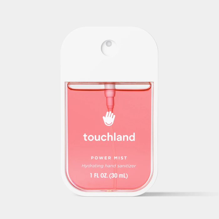 A 1 fl oz (30 mL) bottle of Touchland Power Mist hydrating hand sanitizer in a white hanging card pack, shown against a light gray background.