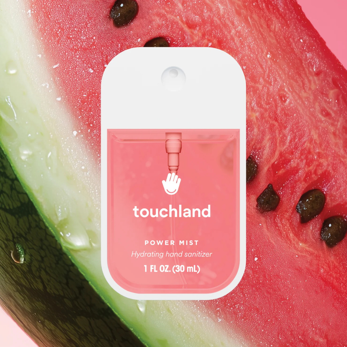 Touchland power mist hand sanitizer packaging on a watermelon background