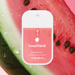 Touchland power mist hand sanitizer packaging on a watermelon background