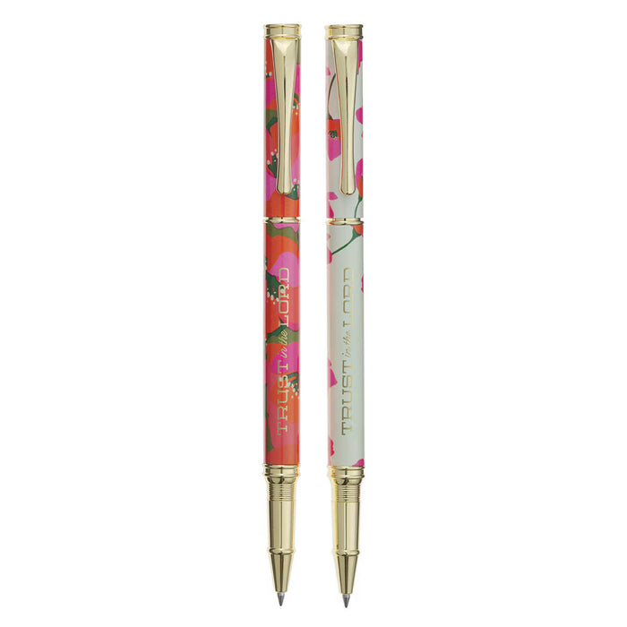 Floral-patterned pen with gold accents on a white background