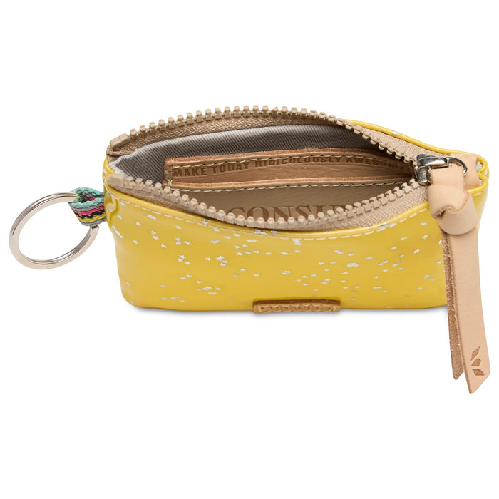 Yellow wallet with floral pattern and keychain on a white background