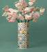 Decorative vase with floral pattern containing pink flowers on a teal background
