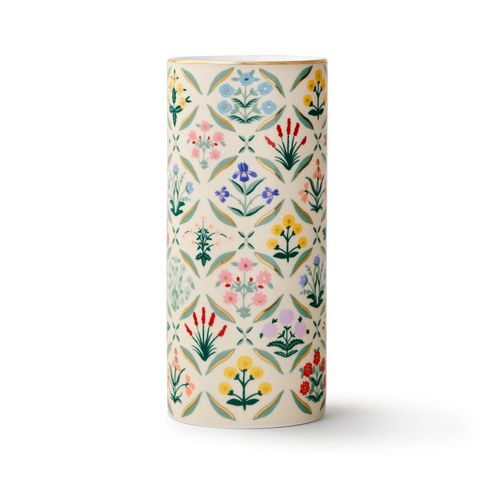 Decorative cylindrical vase with floral pattern on a white background