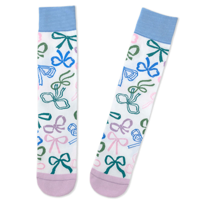 Pair of socks with colorful bow pattern on a white background