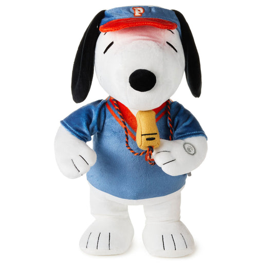 Plush toy resembling a dog with a blue shirt and cap on a white background