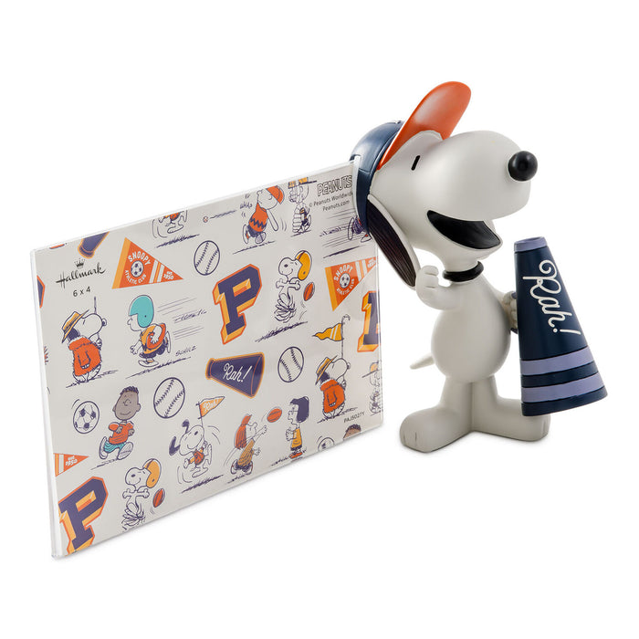 Snoopy figurine holding a Penn State-themed gift bag on a white background