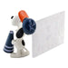 Dog-shaped letter opener with a red nose and blue accents on a white background