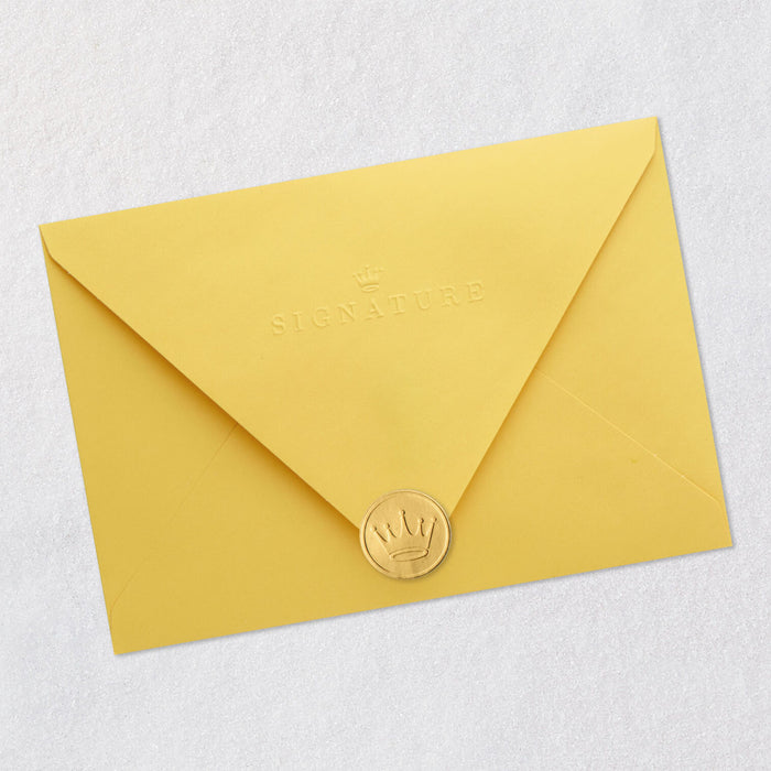 Yellow envelope with a gold seal on a light gray background