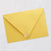 Yellow envelope with a gold seal on a light gray background