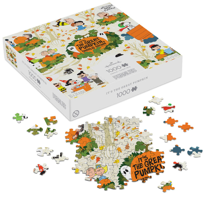 A 1000-piece jigsaw puzzle box for Peanuts' 'It's the Great Pumpkin, 2000' shown on a white background, with several loose puzzle pieces scattered in front of and beside the box.