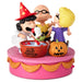 A Peanuts Halloween-themed collectible figurine set on a pink round base. The scene shows Charlie Brown in a wizard hat, Lucy in a purple dress, Snoopy, and a jack-o'-lantern pumpkin, with a red bucket labeled 'IT'S THE GREAT PUMPKIN, CHARLE BROWN' in the center.