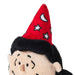 Close-up of a plush toy character wearing a red pointed wizard hat with white stars and a black fluffy wig against a plain white background.