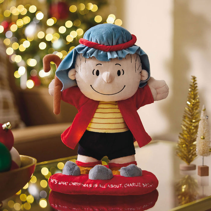 Plush toy of a character from a Christmas-themed setting with blurred lights in the background