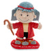 Plush toy of a character from Peanuts with a red coat and blue hat on a white background