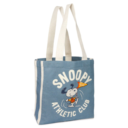 Blue tote bag with Snoopy graphic and text on a white background