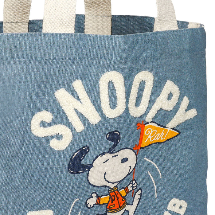 Tote bag with Snoopy design and text on a blue background