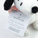 Plush dog toy with a tag featuring the Hallmark logo and 'Peanuts' branding on a white background.