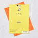 Yellow greeting card with Snoopy illustration and Hallmark logo, featuring an orange envelope on a light gray background.