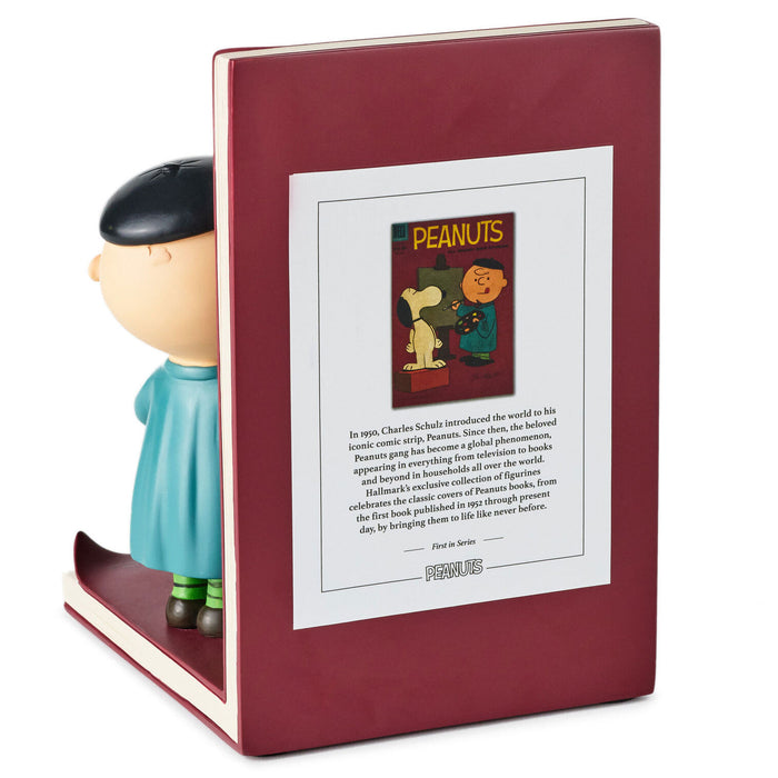 Bookend with Charlie Brown figure and Peanuts comic book illustration on a white background