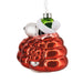 Christmas ornament of a dog in a red glass ball with a white background