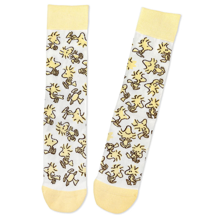 Two socks with yellow cartoon characters on a white background